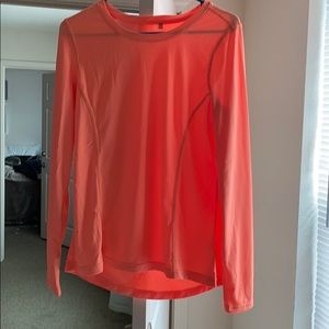 Long sleeve orange workout shirt.